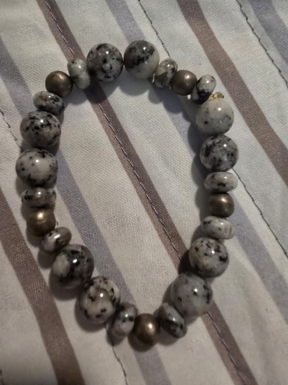Speckled White and Black Beaded Stretch Bracelet with Bronze Accent Beads